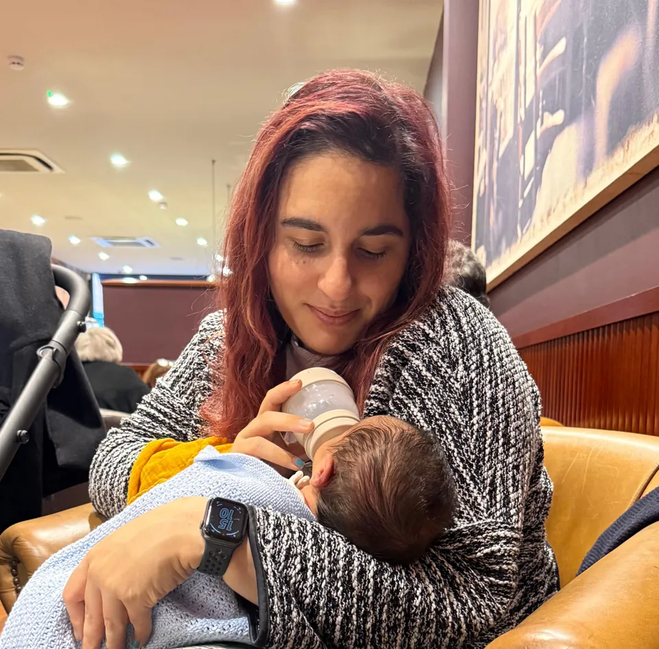 Sonay feeding her baby